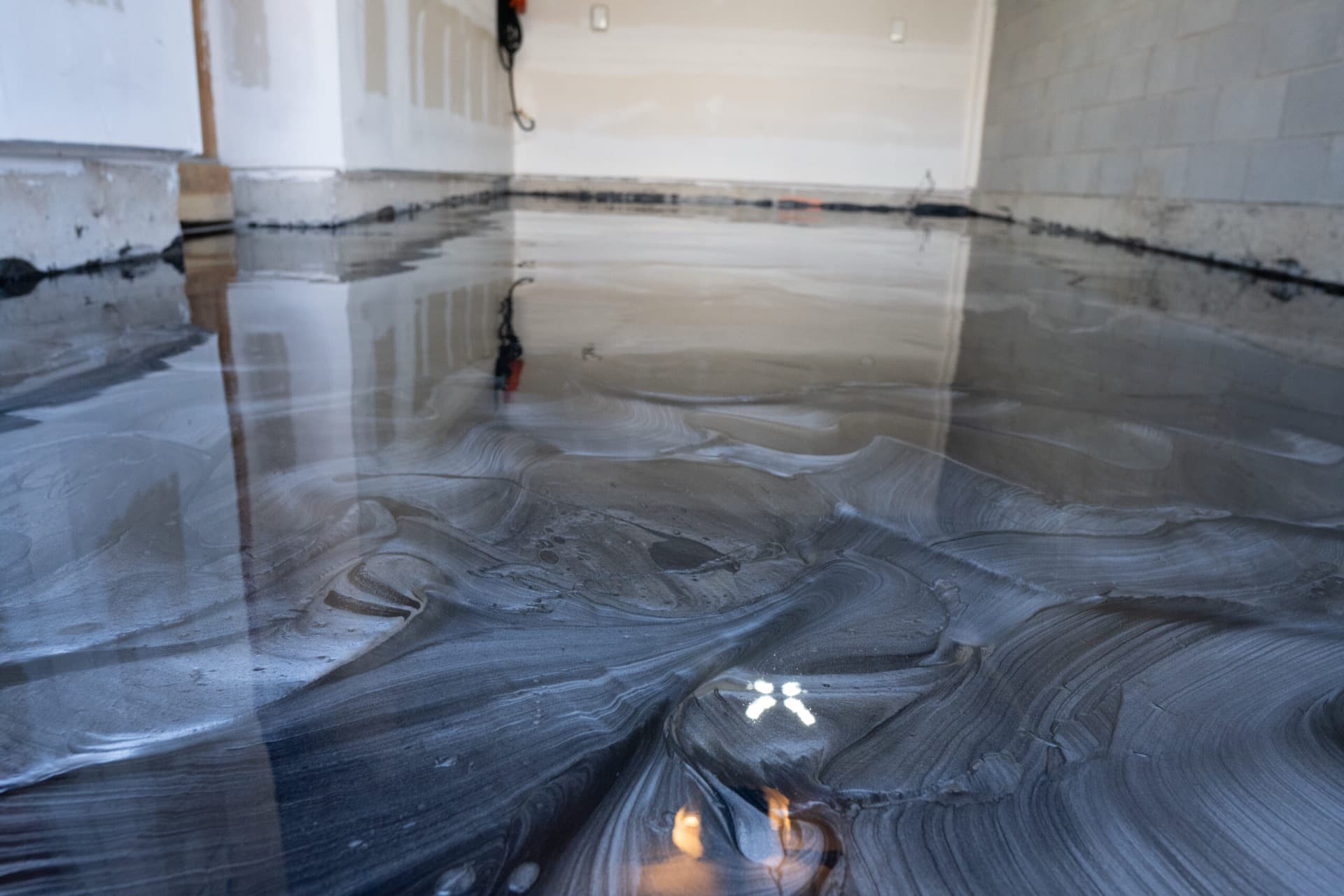 Close detail of the cured metallic epoxy showing silver and charcoal marbling