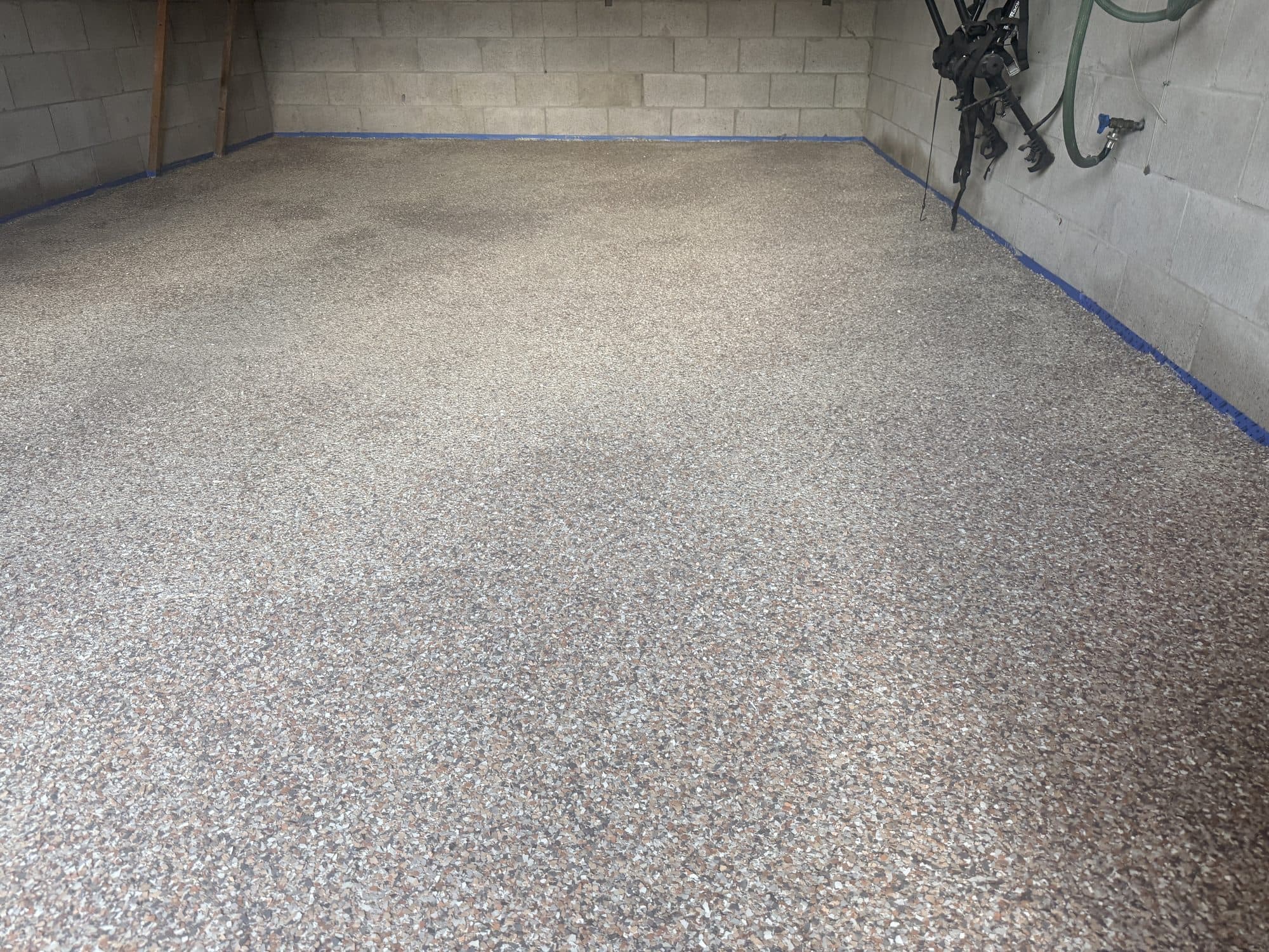 The same garage six days later, finished wall to wall in flake epoxy
