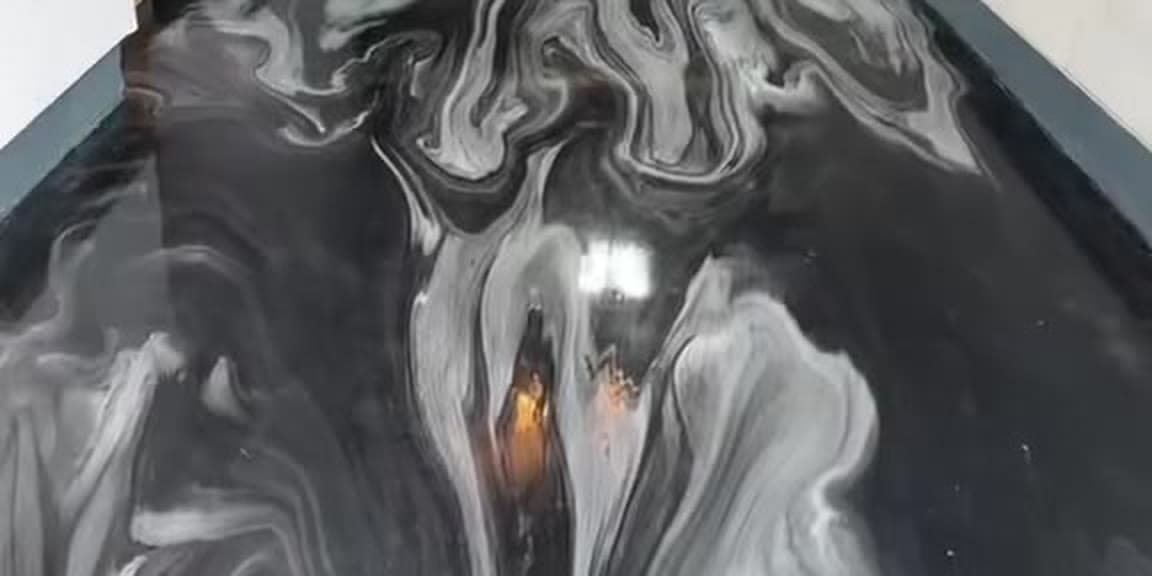 A finished LiquidLux black-and-white metallic epoxy floor in a GTA home